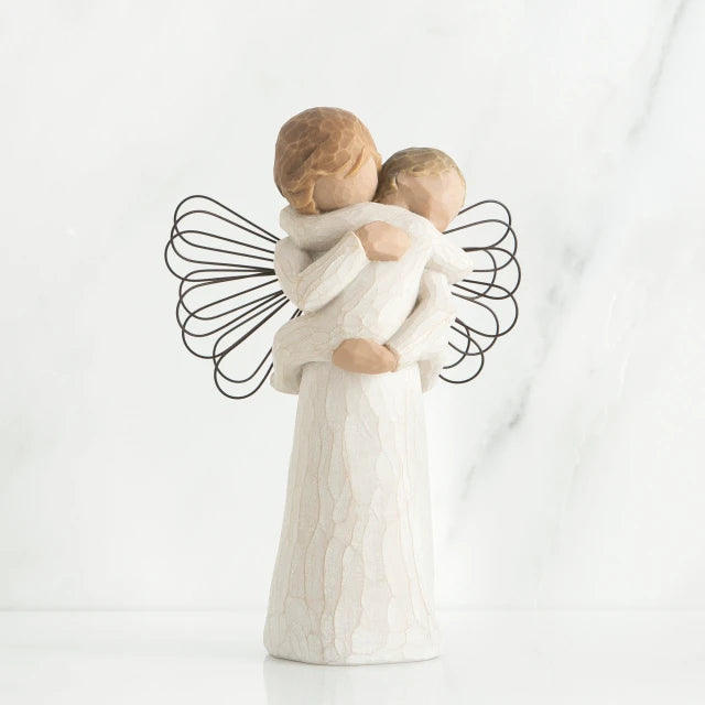 Willow Tree® Young girl angel faceless figurine wearing white dress and has black wire wings, holding faceless baby in her arms