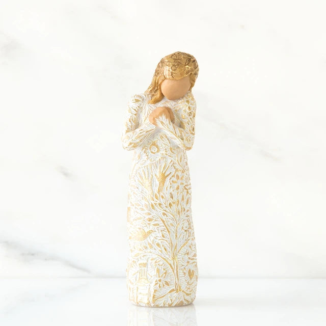 Willow Tree® Faceless blonde woman figurine standing in white golden print dress clutching her hands to her chest