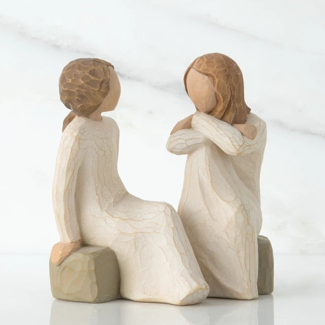 Willow Tree® Two faceless girl figurines sitting on rocks facing each other - both wearing white dresses
