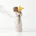 Willow Tree® Front view of standing figure in cream dress with darker skin holding yellow calla lilies in her arms