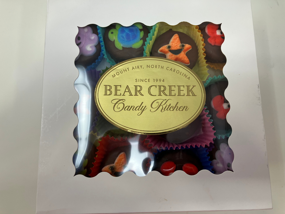 Bear Creek Candy Kitchen chocolate candy box with colorful candy design on a white background