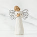 Willow Tree® Small girl figurine with blonde hair wearing white dress and holding light grey animal - she has black wire wings