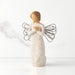 Willow Tree® Front view of standing angel in cream dress with wire wings, crossed hands under small gold-leaf heart, dress carved with symbols of nature