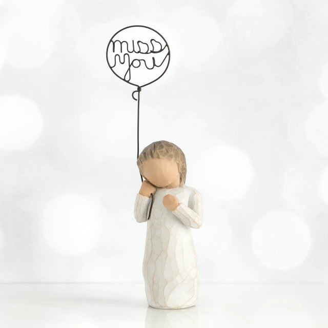 Willow Tree® Small faceless girl figurine in white dress holding 'miss you' black wire balloon