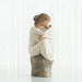 Willow Tree® Small girl figurine wearing white dress holding baby - side view - sitting on brown rock