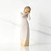 Willow Tree® Front view of brunette girl figurine in white dress with gold dots holding her hands to her face