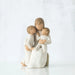 Willow Tree® Faceless mother figurine sitting down holding two faceless children figurines in her arms