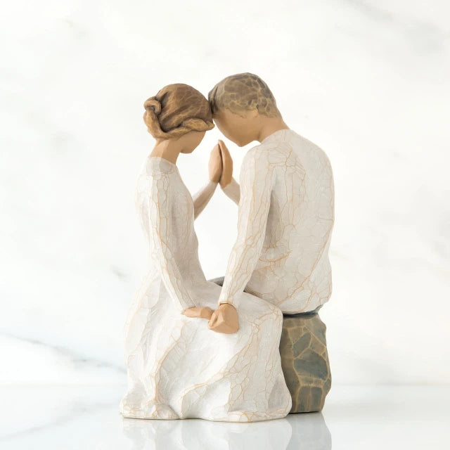 Willow Tree® Man and woman figurine dressed in white holding hands facing one another
