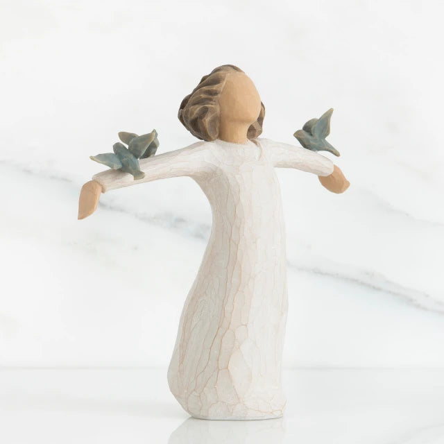 Willow Tree® Brunette girl figurine in whtie dress holding two grey birds on her arms spread out