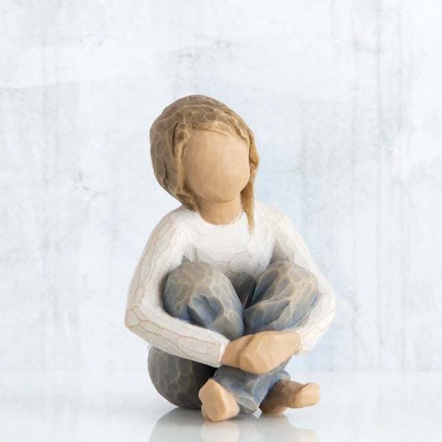 Willow Tree® Little girl figurine sitting with legs crossed - faceless - wearing white shirt and blue jeans