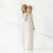 Willow Tree® Two faceless woman figurines standing wearing white dresses hugging one another