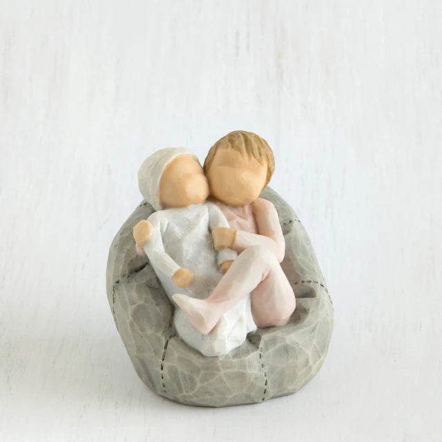 Willow Tree® Two small baby figurines hugging another laying on grey beanbag