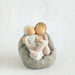 Willow Tree® Two small baby figurines hugging another laying on grey beanbag