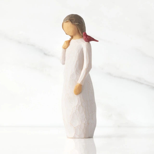 Willow Tree® Front view of standing figure in cream dress with cardinal red bird perched on shoulder