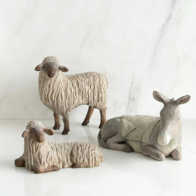 Willow Tree® Two white lamb figurines next to grey donkey figurine with white blanket on its back