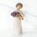 Willow Tree® Girl figurine with short brown hair in white dress holding purple flowers