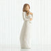Willow Tree® Faceless mother figurine wearing white dress holding baby to her neck