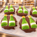 Chocolate Covered Oreo Champagne Bottles Box of 24 in a candy kitchen setting