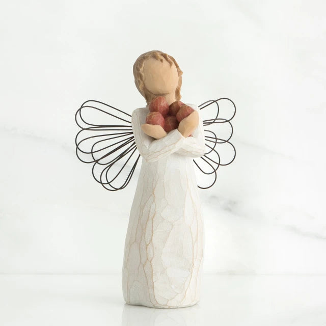 Willow Tree® Young faceless girl figurine wearing white dress and black wire wings, holding red rocks in her hand