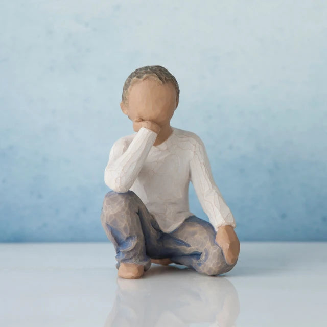 Willow Tree® Small faceless boy figurine kneeling facing forward with one elbow on knee - in white shirt and blue jeans