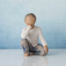 Willow Tree® Small faceless boy figurine kneeling facing forward with one elbow on knee - in white shirt and blue jeans