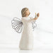 Willow Tree® Faceless girl figurine wearing white dress holding up gold candle