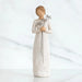 Willow Tree® Front view of girl with brown hair in a bun holding three flowers with long stems up to her chest with both hands