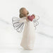 Willow Tree® Faceless angel girl figurine wearing white dress and black wire wings holding maroon heart in her hands