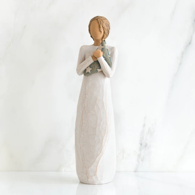Willow Tree® Faceless woman figurine standing facing forward wearing white dress holding star print napkin