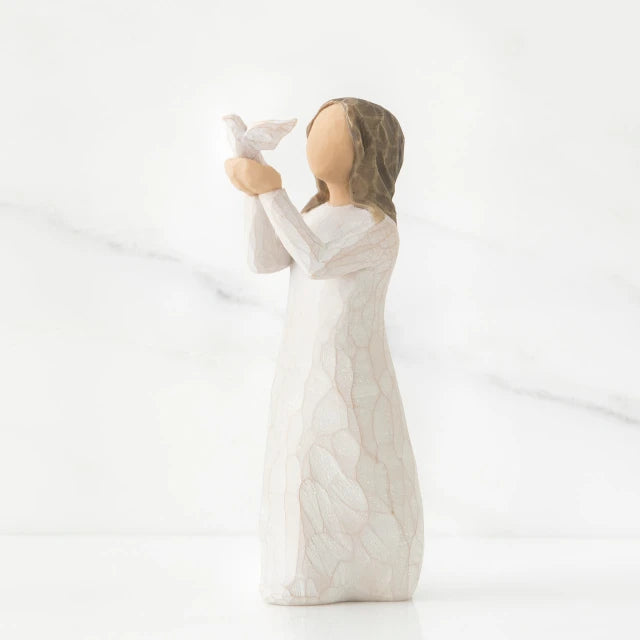 Willow Tree® Faceless woman figurine in white dress holding up white bird in her arms
