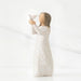 Willow Tree® Faceless woman figurine in white dress holding up white bird in her arms