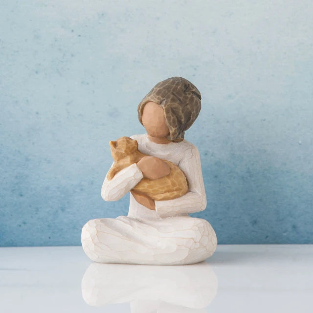 Willow Tree® Small faceless girl figurine sitting down holding golden cat in her arms