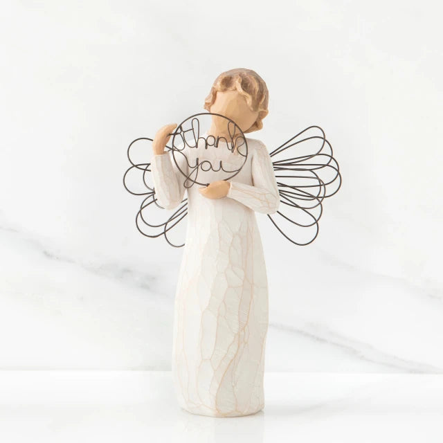 Willow Tree® Front view of angel with tied back brown hair, holding up a circular wire sign that says 